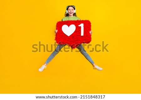 Full length photo of young lady blogger comment feedback click jump up sound isolated over yellow color background