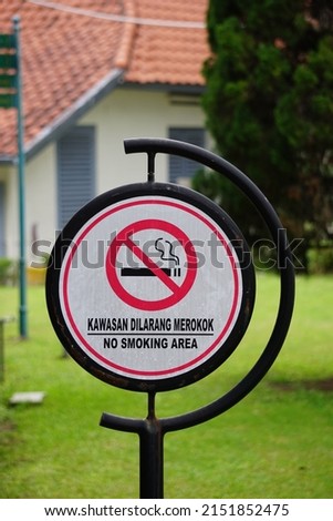 The sign of kawasan di larang merokok. This means the area is no smoking