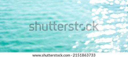 abstract blurred of blue surface water background in cool tone color for presentation banner ads and world ocean day