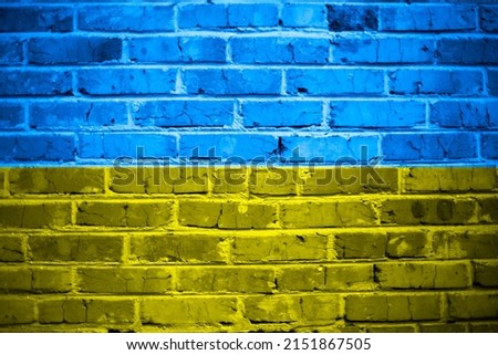 brick wall on the background of the Ukrainian flag.