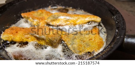 Crispy carp fillet during frying for Christmas dinner in Czech Republic