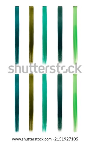 Picture of a set of multicolored strands (tresses) for hair extensions. Colored clip in hair. Green tresses are isolated on a white background. Front view.