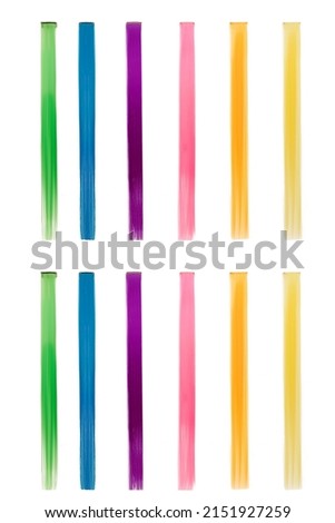 Picture of a set of multicolored strands (tresses) for hair extensions. Colored clip in hair. Rainbow tresses are isolated on a white background. Front view.