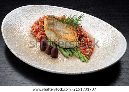 A piece of fried fish pike perch with vegetables, fillet Royalty-Free Stock Photo #2151931707