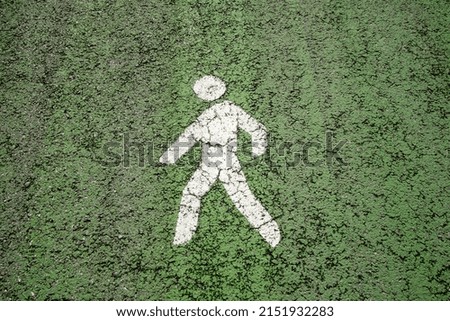 detail of white road signs on a green background, on a cycle path in a street in spain