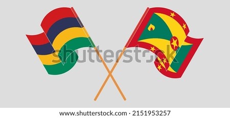 Crossed and waving flags of Mauritius and Grenada. Vector illustration
