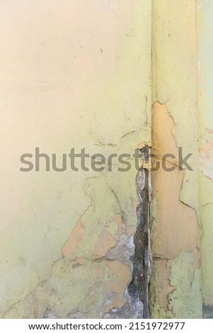 background wall with peeling pastel Colour paint