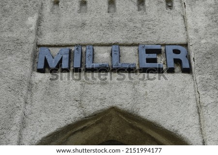 Black letter sign on a stone building