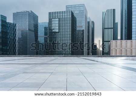 empty ground floor in front of modern office buildings in city  downtown district. Royalty-Free Stock Photo #2152019843