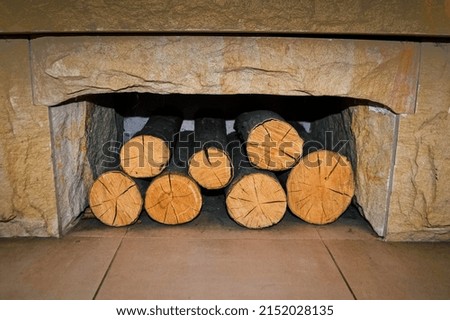 A woodpile of different sizes, made of boards sawn for burning in the oven.Preparation for winter. A pile of logs for firewood. Background with firewood.Old burning boards. High quality photo