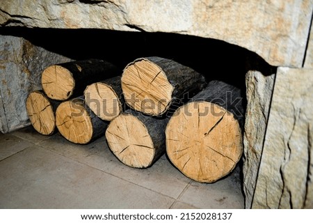 A woodpile of different sizes, made of boards sawn for burning in the oven.Preparation for winter. A pile of logs for firewood. Background with firewood.Old burning boards. High quality photo