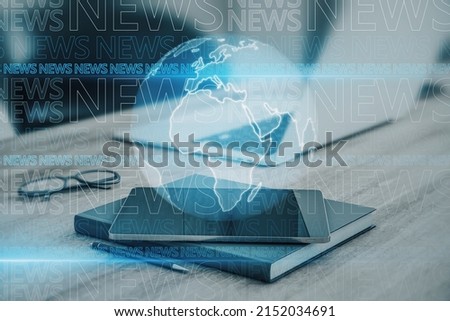 Close up of office desktop on blurry blue breaking news pattern background. Headline, communication and global world concept. Double exposure Royalty-Free Stock Photo #2152034691