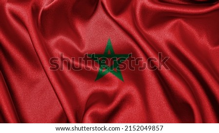 Close up realistic texture fabric textile silk satin flag of Morocco waving fluttering background. National symbol of the country. 18th of November, Happy Day concept Royalty-Free Stock Photo #2152049857