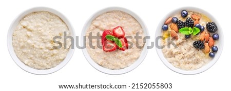 Set of bowl of oats porridge isolated on white background. Top view. Royalty-Free Stock Photo #2152055803