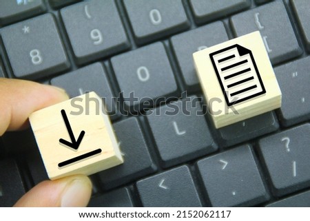 laptop keyboard and wooden cube with save icon Concept