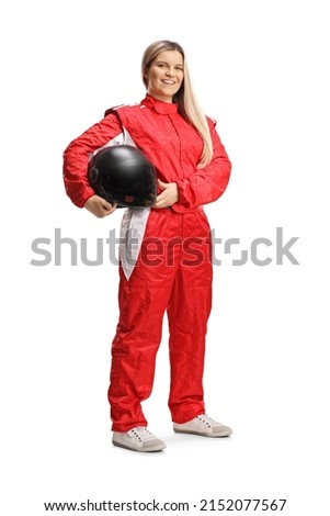 Female racer in a red suit posing and holding a helmet isolated on white background Royalty-Free Stock Photo #2152077567