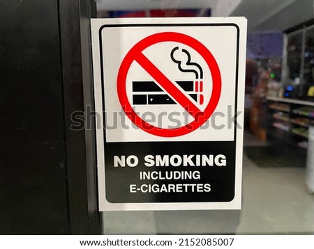Augusta, Ga USA - 04 27 22: No smoking sign on a glass door