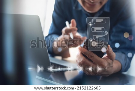 Chatbot conversation assistant on smartphone app interface with artificial intelligence technology providing virtual assistant, customer support. Business man using mobile phone talking with chatbot Royalty-Free Stock Photo #2152122605