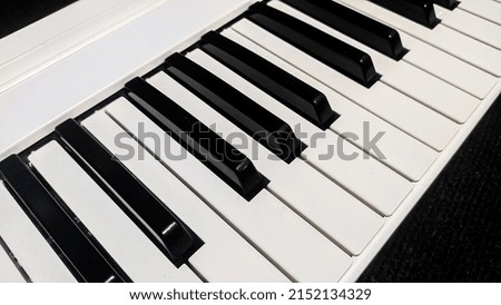 Close-Up Piano musical instrument on black carpet