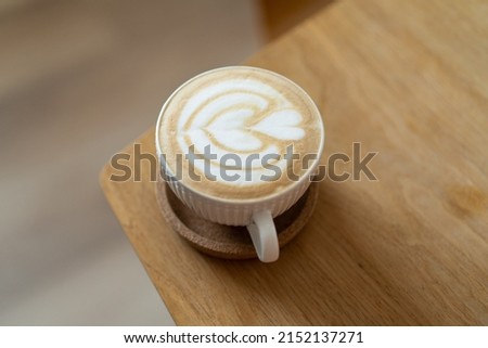 Beautiful latte art cup of coffee - cappuccino
