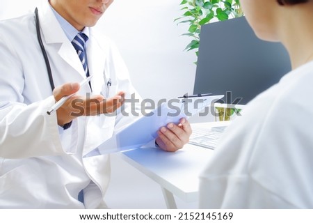 Japanese male doctors and female patients Royalty-Free Stock Photo #2152145169