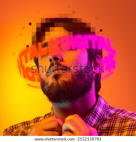 Contemporay artwork. Young man in checkered shirt with pixel head parts and lettering around isolated over yellow background in neon. Concept of digitalization, artificial intelligence, technology era