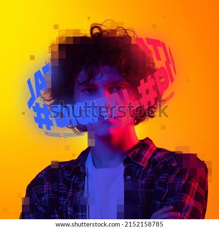 Contemporay artwork. Young curly boy in checkered shirt with neon lettering around head isolated on yellow background in neon light. Concept of digitalization, artificial intelligence, technology era
