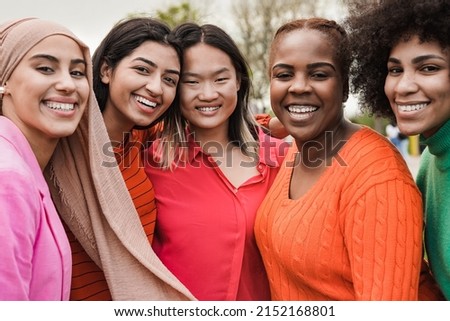 Happy multiracial women smiling on camera - Beautiful diverse female friends