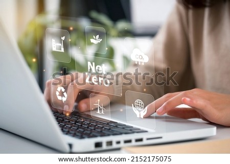 women hand using laptop for working technology and business 
Net zero and carbon neutral concept.NET ZERO icons and symbols save the eco world and reduce pollution. greenhouse gas emissions target.  Royalty-Free Stock Photo #2152175075