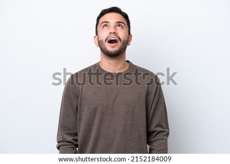 Young Brazilian man isolated on white background looking up and with surprised expression Royalty-Free Stock Photo #2152184009