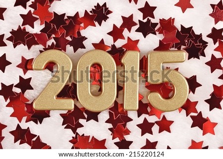 2015 year golden figures on the background of red stars