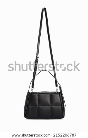 Side view on Women Black Leather Handbag Hanging with long strap Isolated on White Background