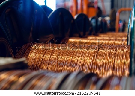 Production of copper wire, cable in reels at factory. Cable factory. Royalty-Free Stock Photo #2152209541