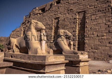 Statues of Amun in the majestic temple of Karnak in Luxor, Egypt