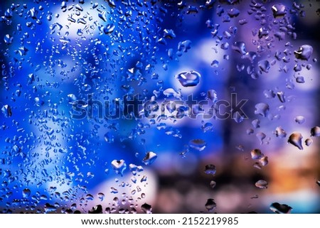 Condensation on the clear glass window. Water drops. Rain. Abstract background texture.