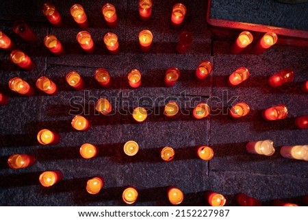 Tribute to the deceased with red candles Royalty-Free Stock Photo #2152227987