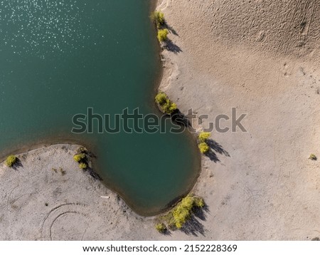 Aerial view of sandy beach, dunes and turquoise water seen from above. Background with copy space and place for text. Photography taken in September in Sweden.