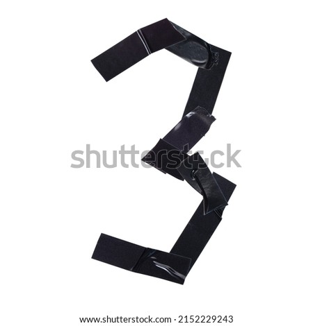 The number three, 3 is made with pieces of black electrical tape on a white background, close-up, decorative font.
