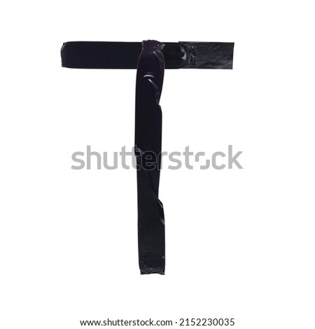 The letter T is made with pieces of black electrical tape on a white background, close-up, decorative font, letters and numbers from black tape