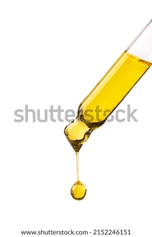 Dropper with cosmetic oil drop isolated on white background. Abstract drop of skin care oil. Royalty-Free Stock Photo #2152246151