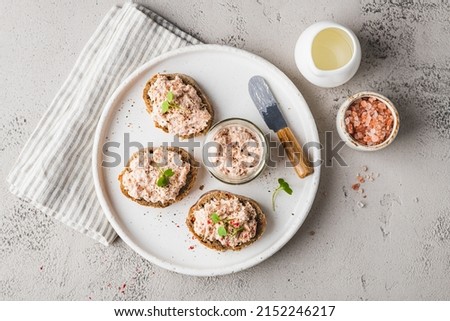 bruschetta with tuna pate, fish rillettes, sandwich on a white plate, top view Royalty-Free Stock Photo #2152246217