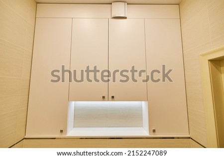 white cabinet for toiletries. Modern stylish marble bathroom with white toiletries cabinet Royalty-Free Stock Photo #2152247089