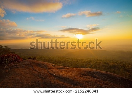View of mountains and cliffs in the evening,Cliffs and mountains,Empty standing on top of mountain view, empty cliff edge with mountains on clouds, turquoise sky Royalty-Free Stock Photo #2152248841