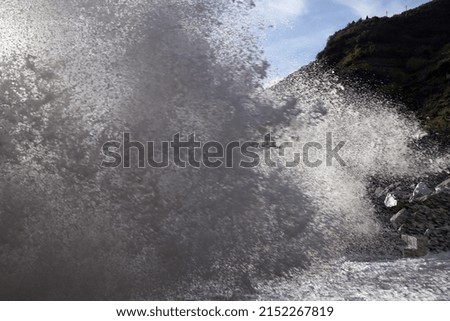 Big waves beaking on the shore