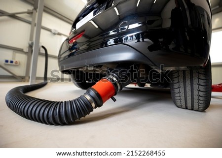 Vehicle emissions testing involves putting an automobile through a series of stringent assessments to discover its fuel efficiency and the amount of greenhouse gases it produces. Royalty-Free Stock Photo #2152268455