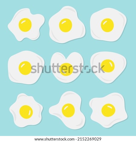 Set of fried eggs. Isolated eggs on a blue background. Yolk and protein.	
