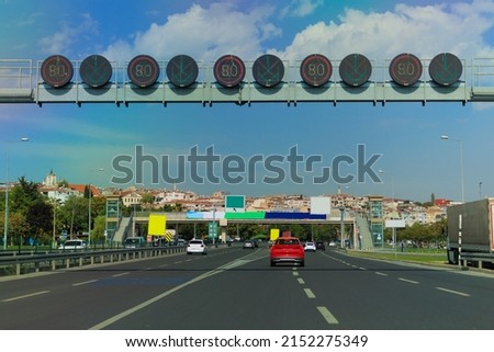 Road signs and information boards on the streets of the city on a summer day. Background for pointers, design and advertising.