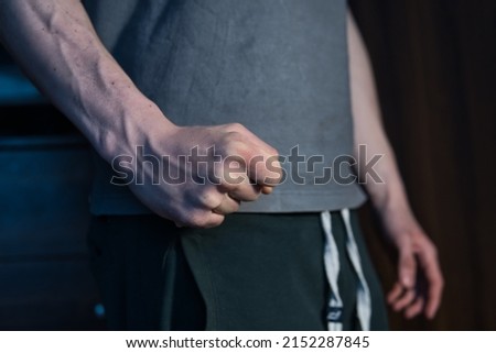 close-up on the fist of an aggressive man. a concept showing violence against people, domestic violence, frustration, irritation and anger Royalty-Free Stock Photo #2152287845