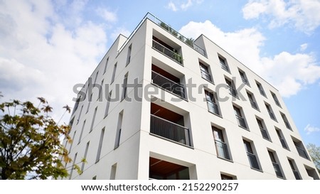Modern luxury residential flat. Modern apartment building on a sunny day. Apartment building with a blue sky. Facade of a modern apartment building. Royalty-Free Stock Photo #2152290257