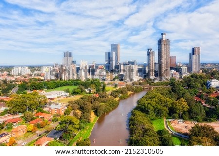 Narrow Parramatta river in Western Sydney Parramatta CBD council - aerial cityscape to high-rise urban towers. Royalty-Free Stock Photo #2152310505